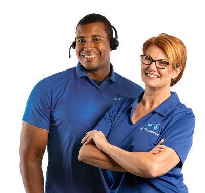 Two AmplifyHealth Advisors standing together in branded uniforms, representing professional and supportive healthcare services.