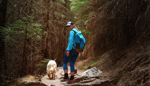 Woman hiking with her dog