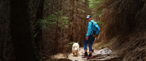 Woman hiking with her dog