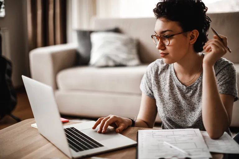 Young woman working at home