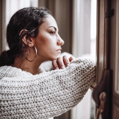 Woman in front of the window