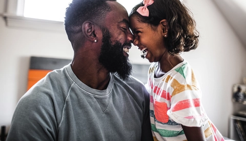 Father and daughter laughing