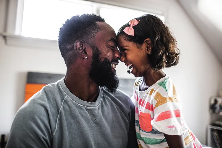 Father and daughter laughing