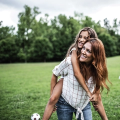 Woman laughing with children 