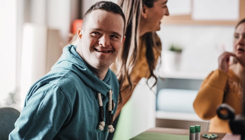Person with Down syndrome doing an art project