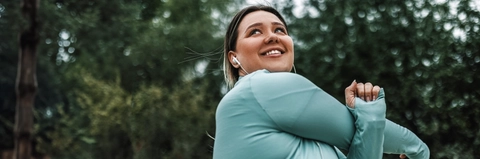 Young woman stretching outdoors