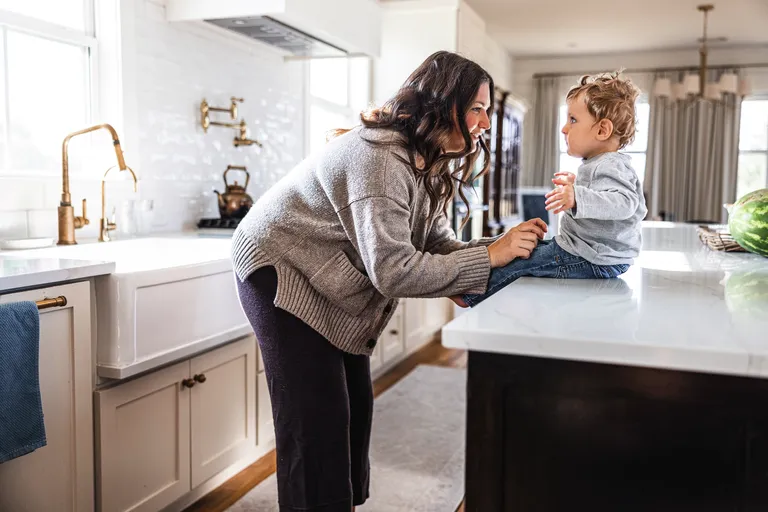 Mother and son in kitchen