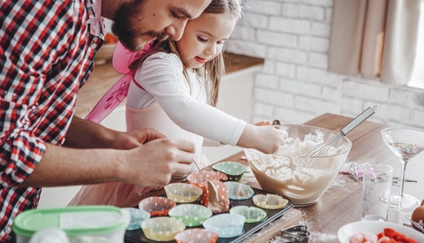 Father baking with daughter