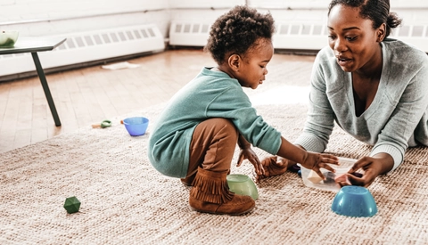 Mom and toddler playing on the floor