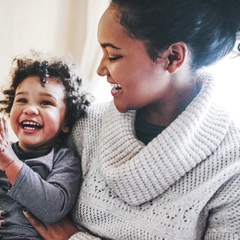 Mother and baby laughing