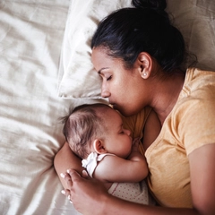 Woman holding a sleeping baby