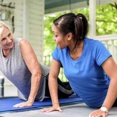 Happy ladies doing push ups