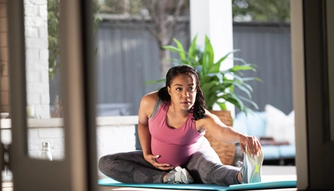 Pregnant woman stretching