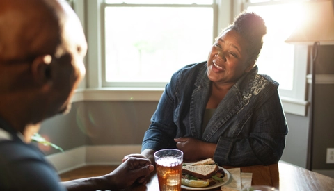 Woman enjoys time with her husband at kitchen table