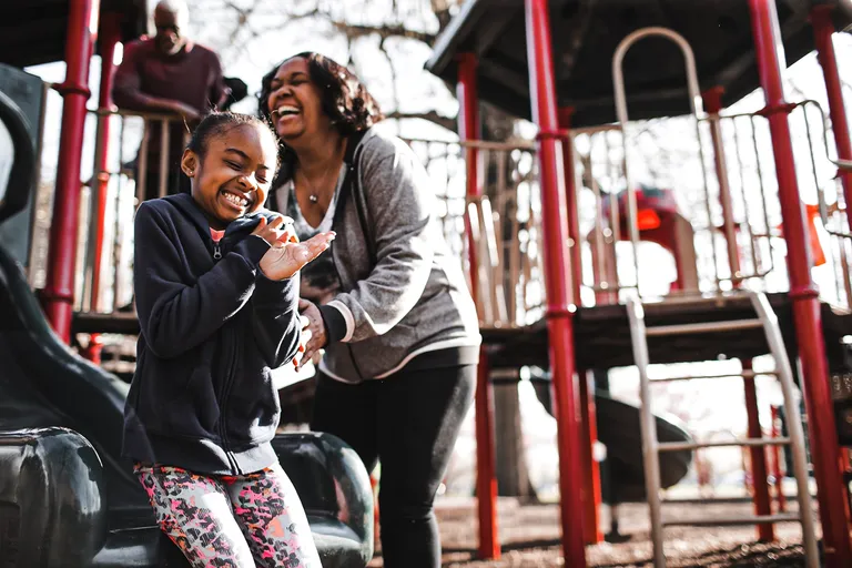 Woman with child in park