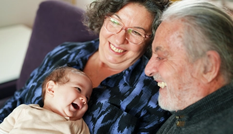 Baby smiling to his grandparents
