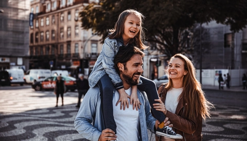 Young family having a stroll together in the city