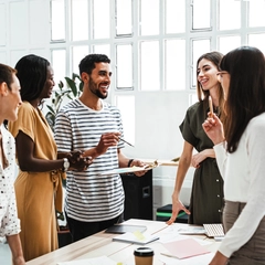 Group of young adults in an office creative meeting
