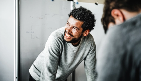 Smiling man in casual business meeting