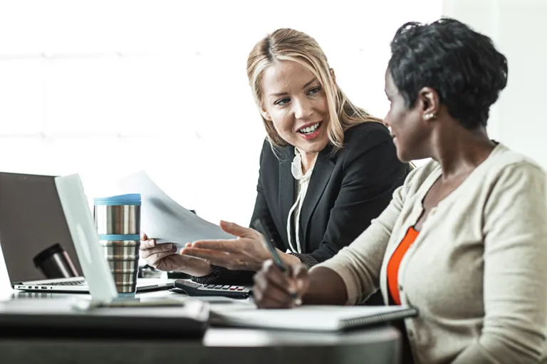 Two women working in office setting
