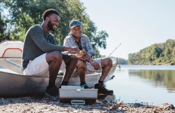 Father and adult son fishing 