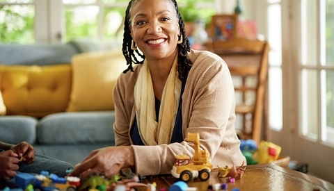 happy older woman at table