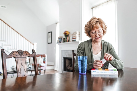 Senior woman organizing medication