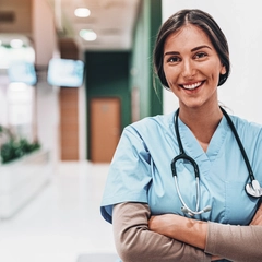 Nurse Smiles While Looking At Camera