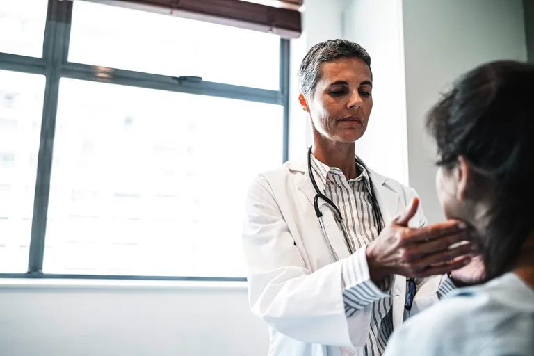 Medical Provider Checking Patient's Lymph Nodes