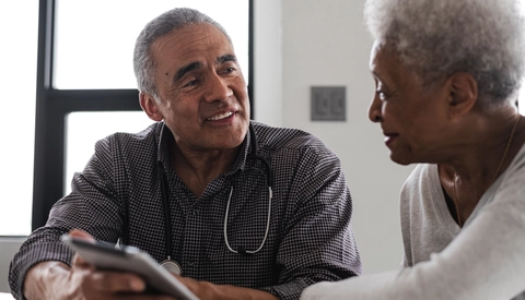 Male Physician Talking to Female Patient
