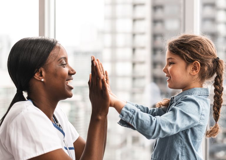 Child Giving Medical Professional a High-Five