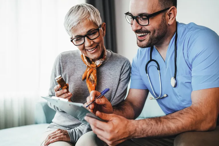Doctor consulting with a senior female patient