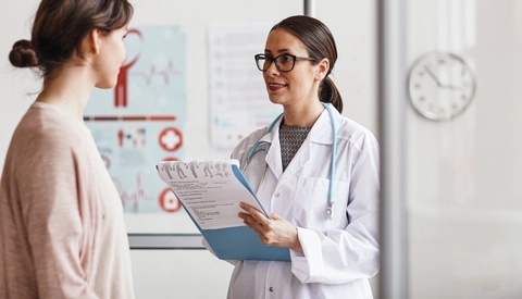Doctor talking to female patient