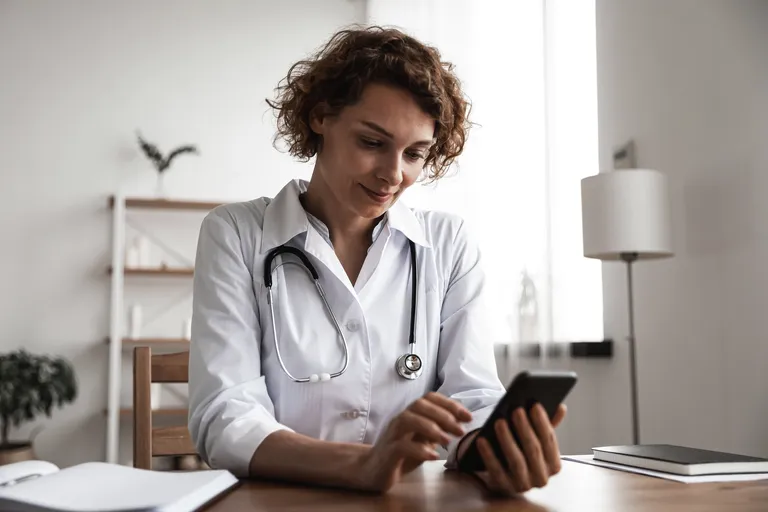 Female Medical Provider Using Mobile Phone