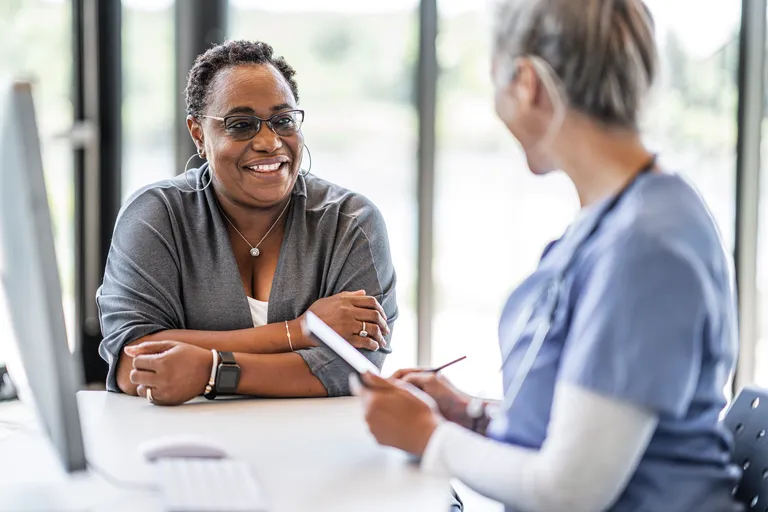 Female patient talking to her doctor