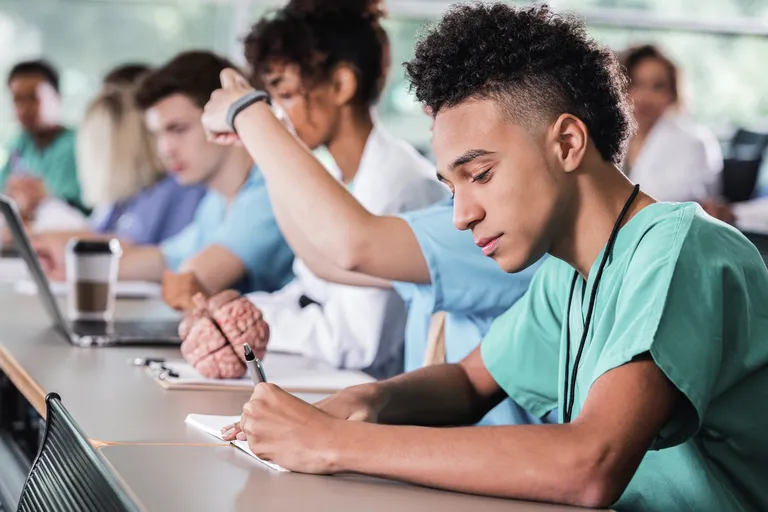 Medical student working on class assignment