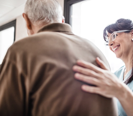 Female Medical Provider Supporting Male Patient